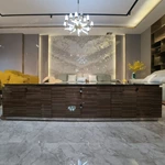 Sophisticated TV Stand with Dark Marble Top, Natural Wood Veneer Panels and Concealed Storage Drawers